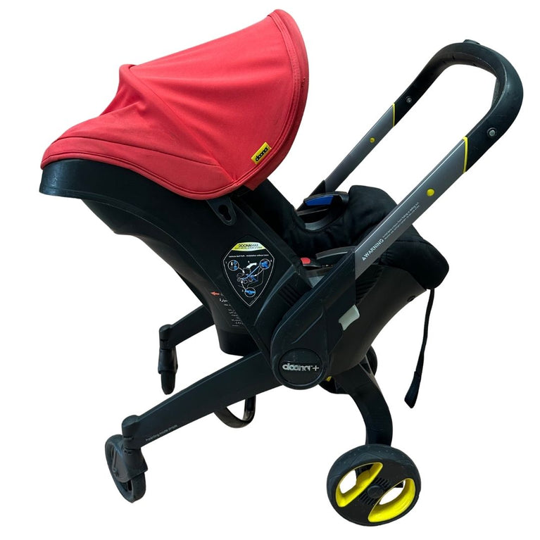 Doona Stroller - Flame Red with Footmuff, Newborn Insert & Snap On Storage